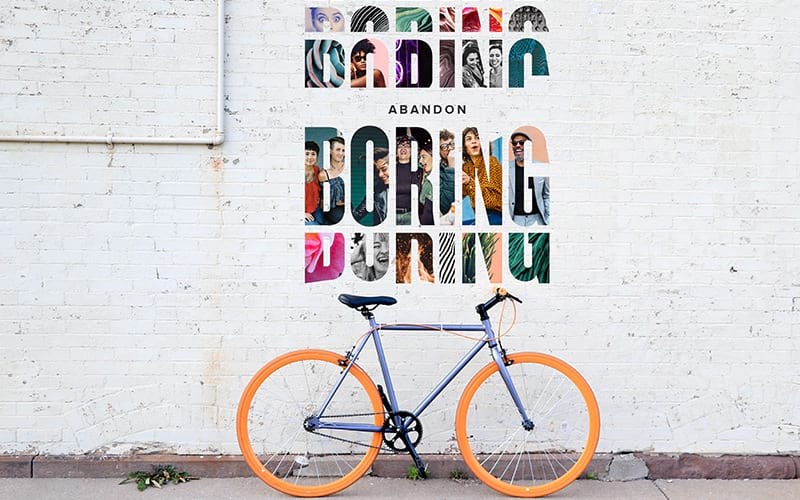 A bike sitting up against a wall mural 
